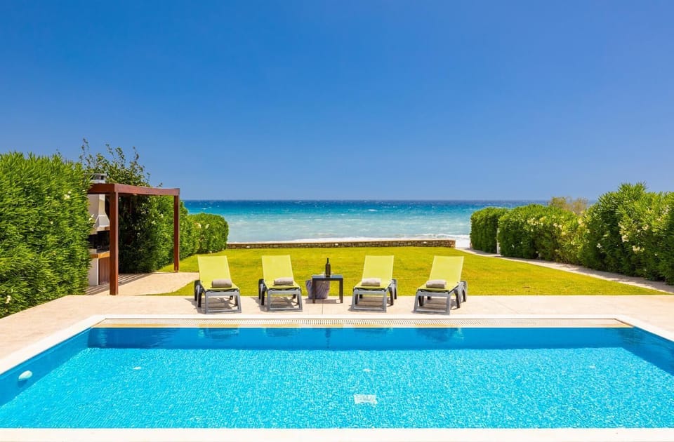 Private pool, terrace, and garden with panoramic sea views