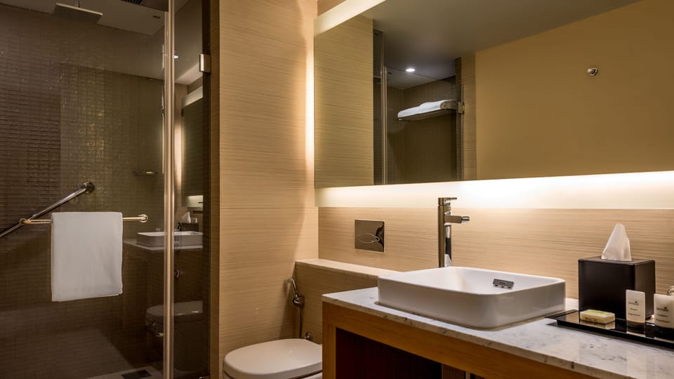 Shower, rainfall showerhead, designer toiletries, hair dryer