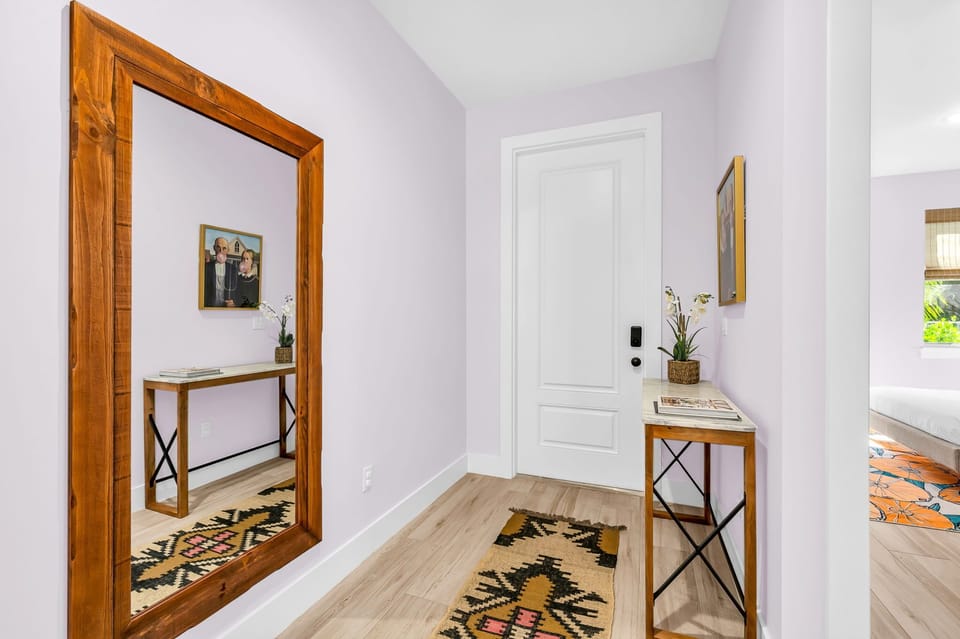 Step into the timeless elegance of our mid-century entrance hall. As you cross the threshold, you're greeted by a curated space that seamlessly blends mid-century modern charm with contemporary comforts.