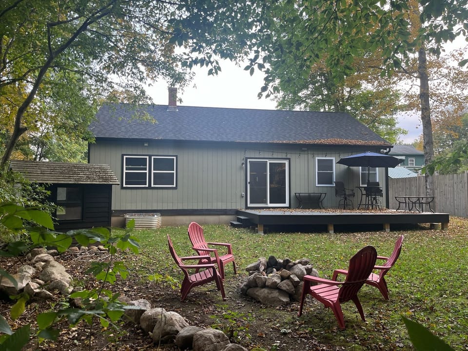Our backyard oasis with a patio and inviting firepit.