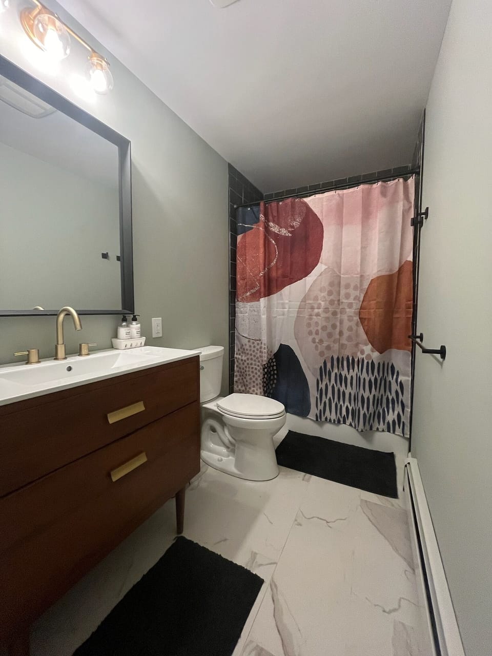 Main bathroom w/ shower/tub combo. The 1/2 bath is off of the main living room