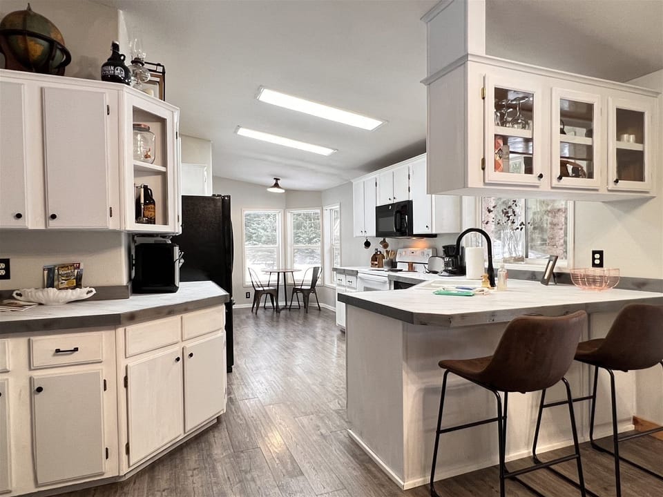 Open concept kitchen stocked with everything you could need for your vacation.