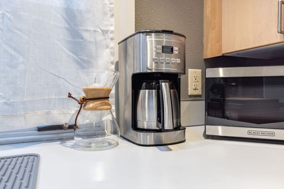 Coffee/Tea maker and microwave.