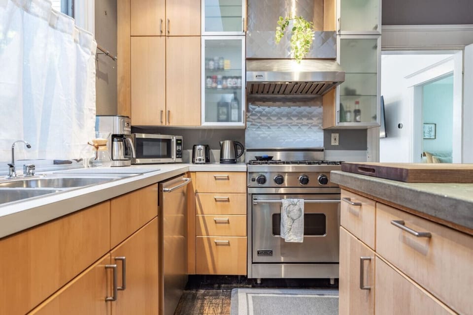 All stainless steel appliances, featuring a gas stove.