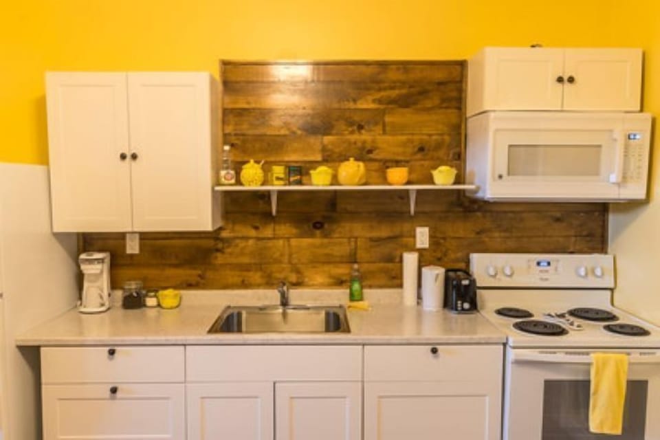 Standard Apartment, 1 Queen Bed with Sofa bed, Accessible, Fireplace (Stateroom 10 by Canalside Inn) | Private kitchen | Fridge, microwave, stovetop, coffee/tea maker