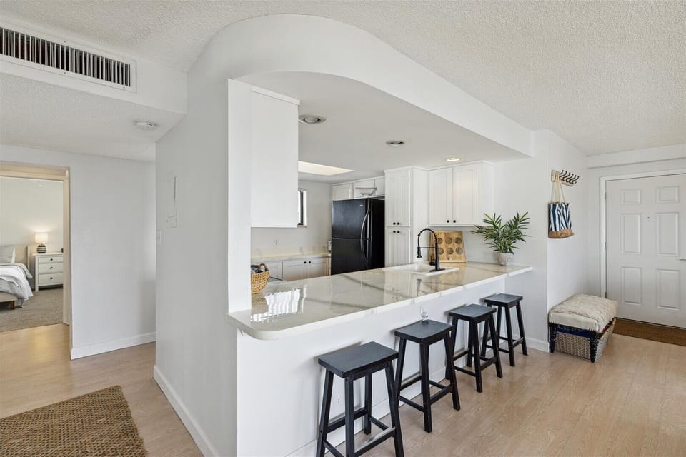 Bright and modern kitchen with a stylish breakfast bar for casual dining