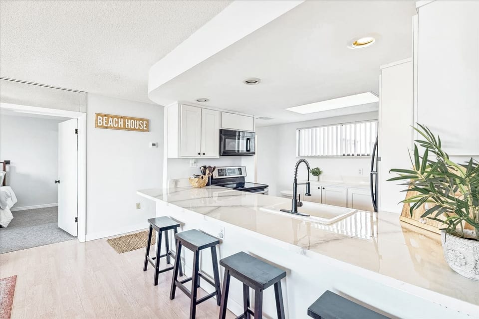 Modern and stylish kitchen with bar seating and plenty of natural light