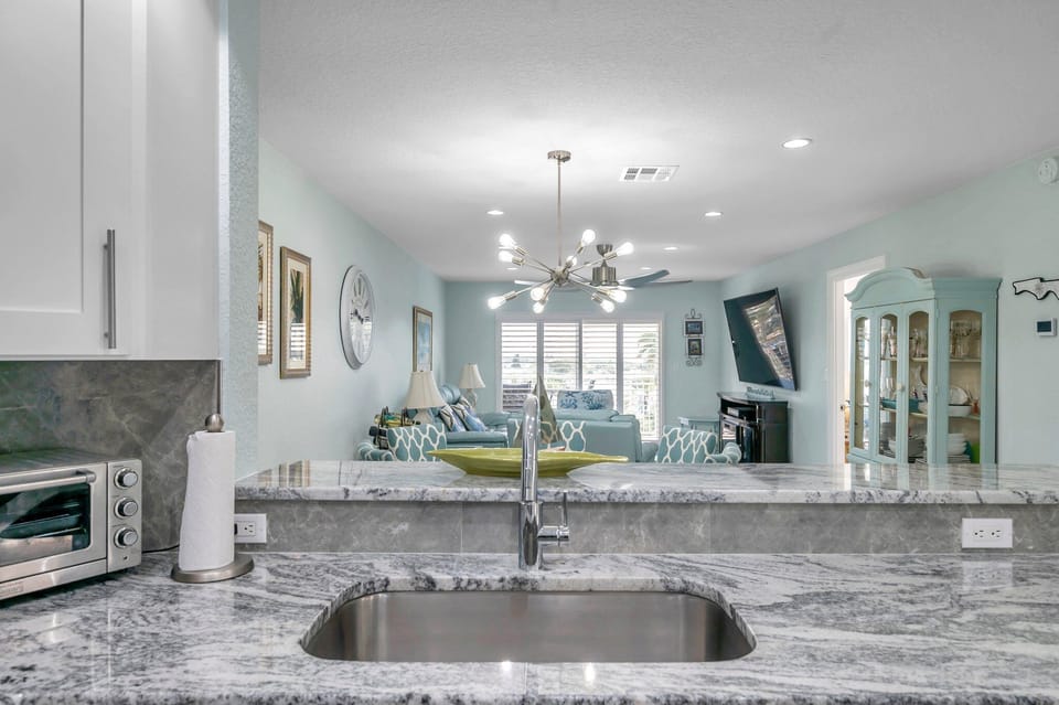 Kitchen Sink Located In Peninsula Providing Open and Unobstructed Views 