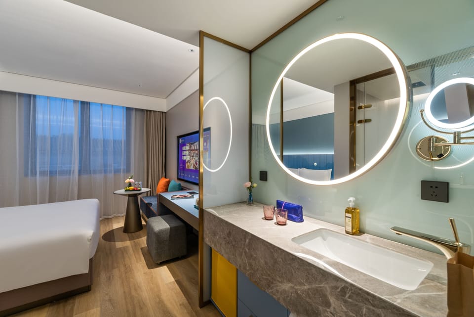 Shower, designer toiletries, hair dryer, bathrobes