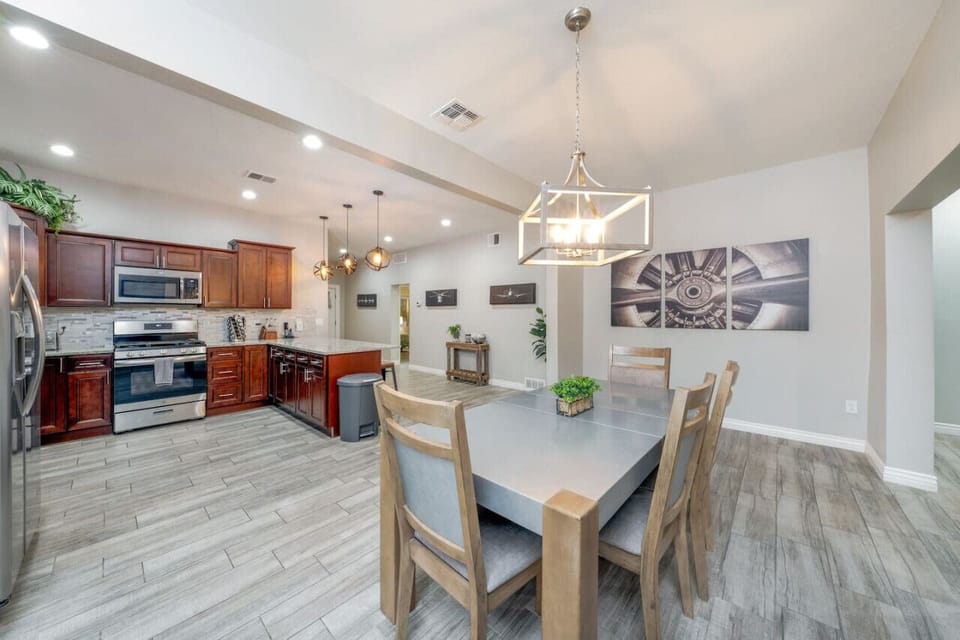 Open concept floor plan with spacious, updated kitchen and dining area for six
