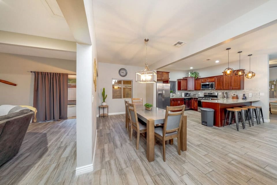 Fully equipped kitchen with extra seating, flowing right into the dining and living areas