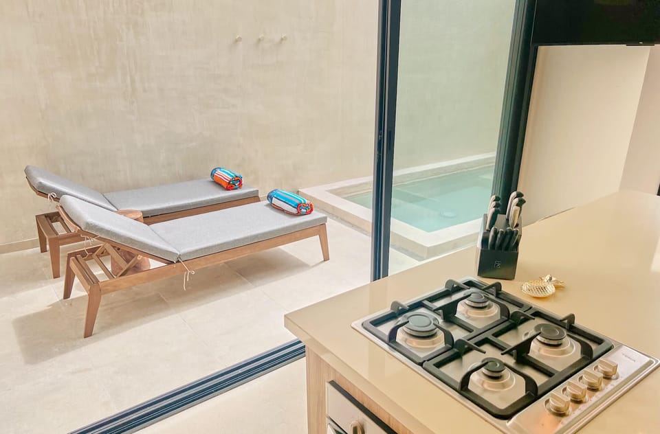 Fully equipped kitchen that opens up to private pool