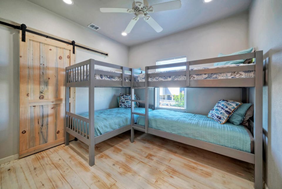 Bedroom 3 features two twin-over-twin bunk beds.