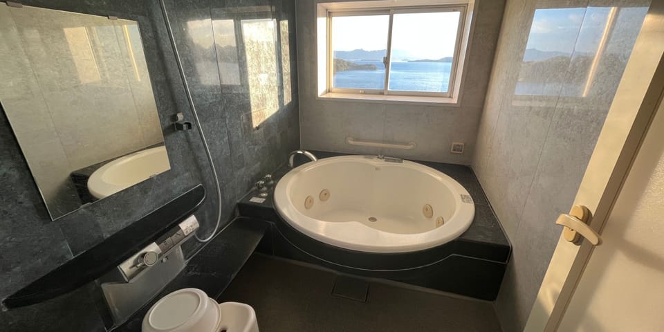Signature Suite | Bathroom | Separate tub and shower, rainfall showerhead, free toiletries