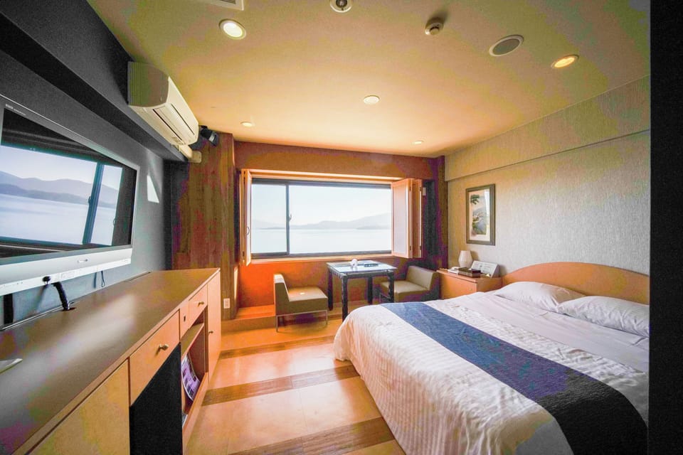 Deluxe Double Room | Down comforters, blackout drapes, iron/ironing board, WiFi (free)