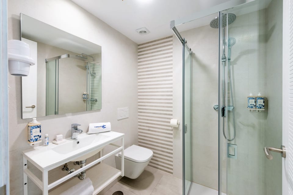 Rainfall showerhead, hair dryer, towels, soap