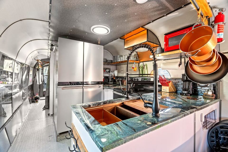 The Moto Ranch at Croom Our Chinook 2 bedroom 1 bath sleeps 6 one of a kind inside Croom motorcycle area state forest full kitchen, french door refrigerator/freezer copper sink, stove, oven, microwave, coffee maker, stocked kitchen cookware, utensils, flatware and kitchen basics 