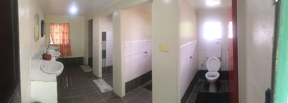 Basic Shared Dormitory, Multiple Beds, Partial Ocean View, Ground Floor | Bathroom | Towels, soap, shampoo, toilet paper