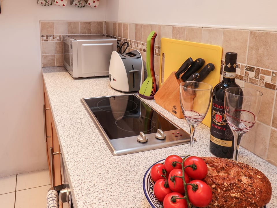 Fridge, electric kettle, toaster, cookware/dishes/utensils