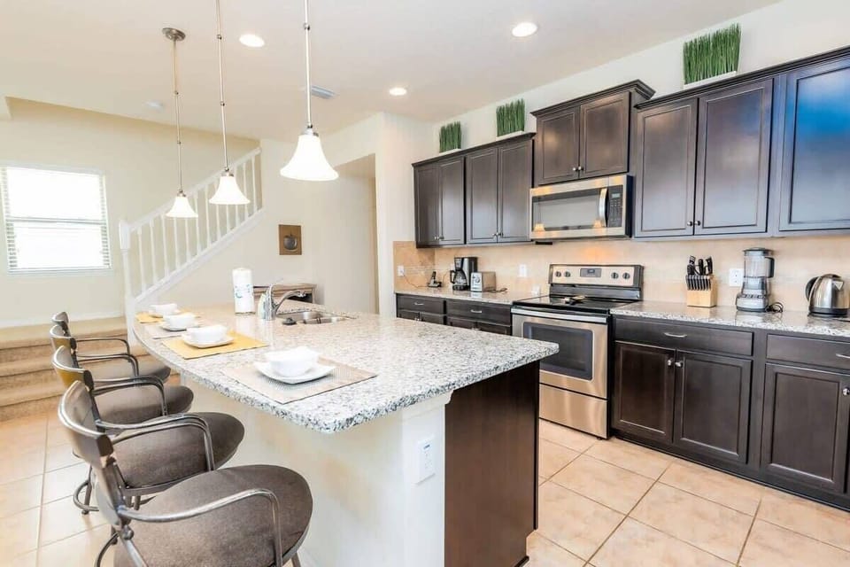 A fully-equipped kitchen with a dishwasher.