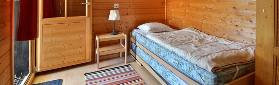 Bedroom 3 with 2 beds and sink
