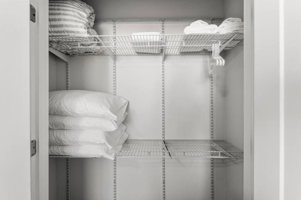 Closets equipped with extra cozy bedding for pullout in living room