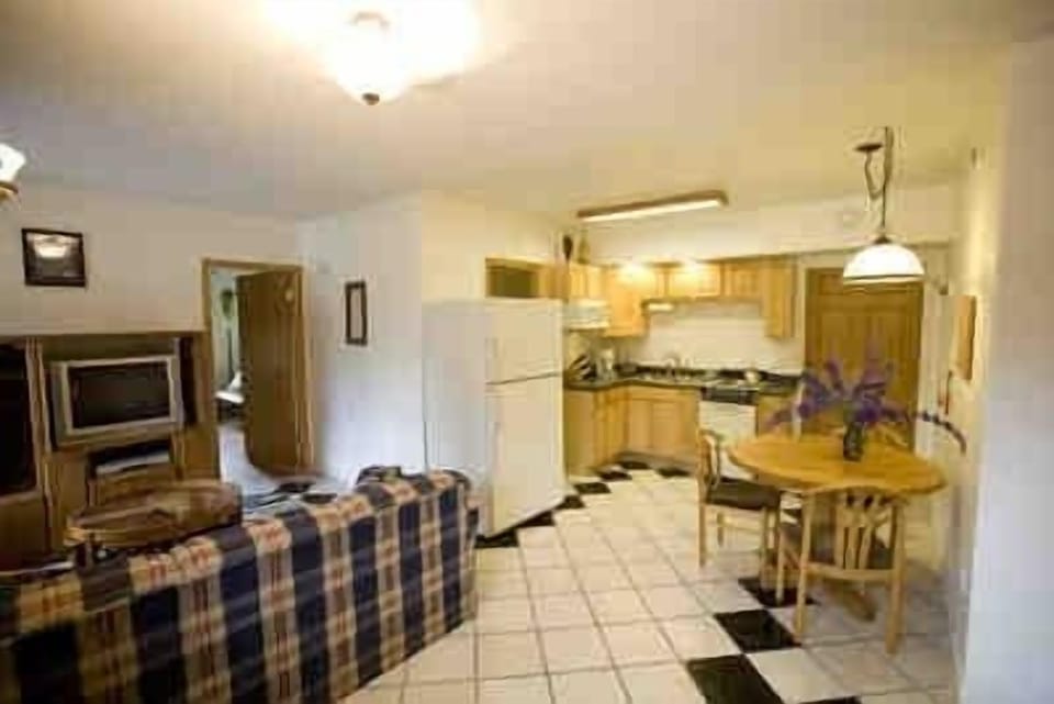 Superior Suite, 1 King Bed, Jetted Tub | Private kitchen | Coffee/tea maker, full-size fridge, microwave, oven