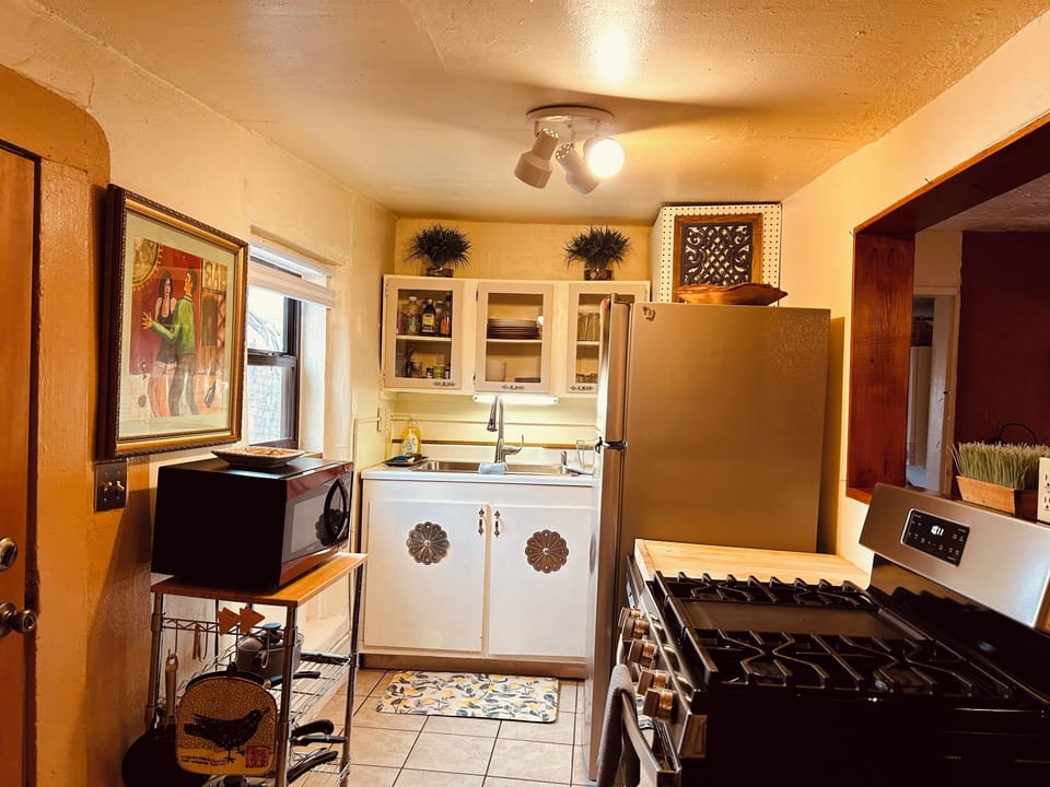 The kitchen boasts stainless steel appliances for delicious meals at home