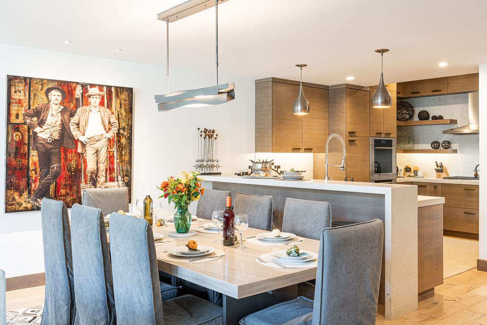 Contemporary lighting and cushioned chairs
