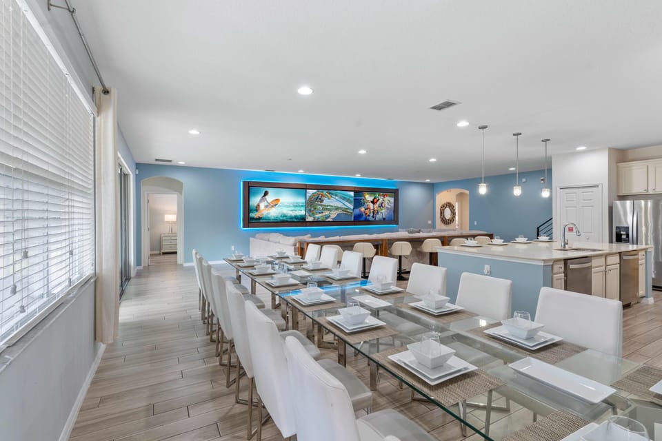 - Bright dining setup with seating ready for the full group  
- Modern open plan design flows into kitchen and lounge  
- Comfortable space for family dinners parties and stays