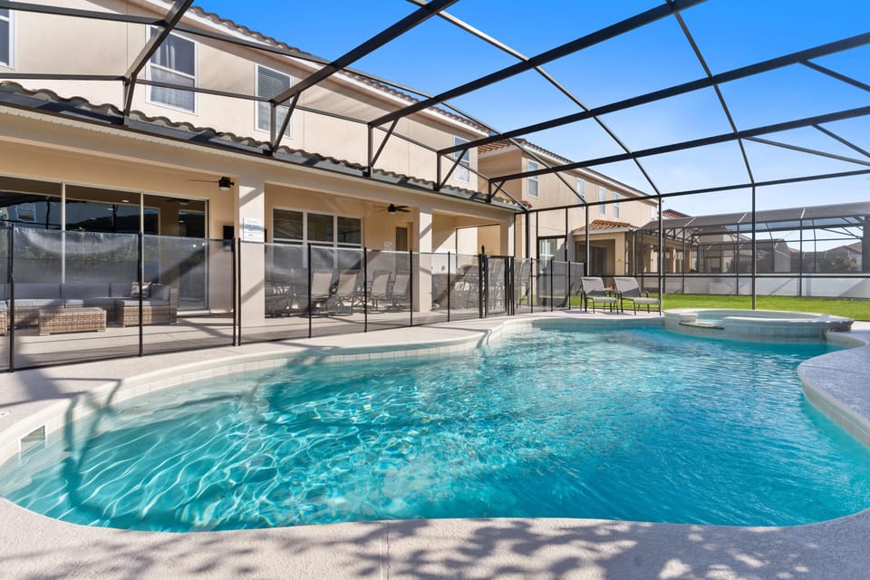 - Enclosed private pool with relaxing spa and patio seating  
- Screen enclosure keeps family swimming comfortable and safe  
- Spacious pool area perfect for sunshine and relaxation