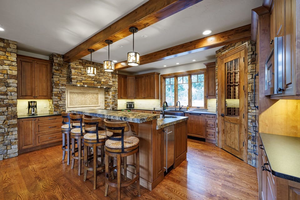 The spacious island offers ample seating, making it a perfect gathering spot for family and friends