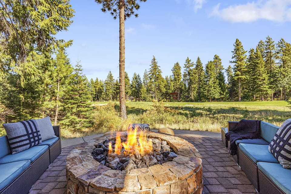 Enjoy the perfect blend of nature and comfort at this mountain home outdoor fire pit