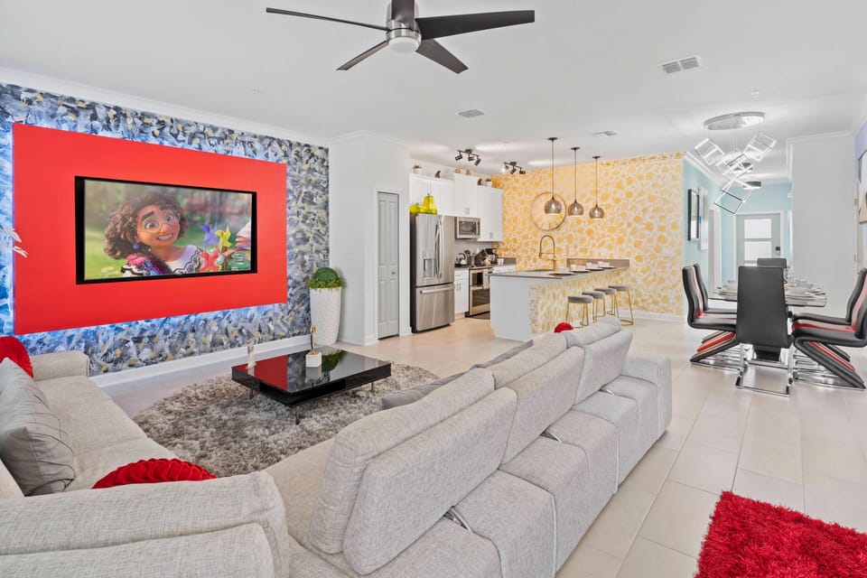 A spacious living area with a large seating capacity sofa for all of the guests to be entertained while watching TV