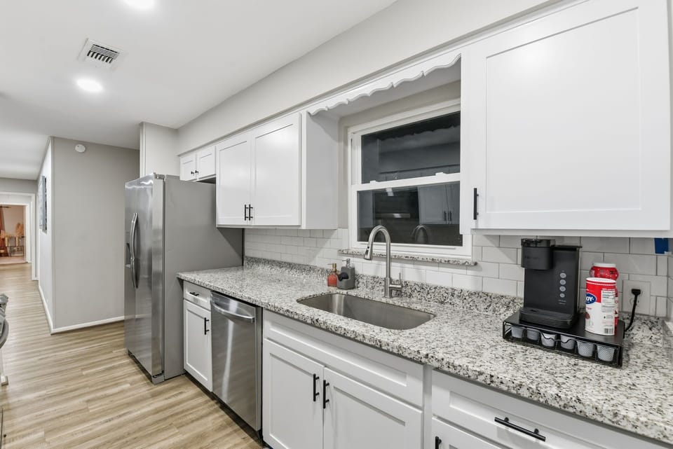 Kitchen includes refrigerator/freezer, all dishes, glasses, & utensils, dishwasher, & a Keurig for morning coffee. Your 1st morning coffee is on us, we leave pods :)