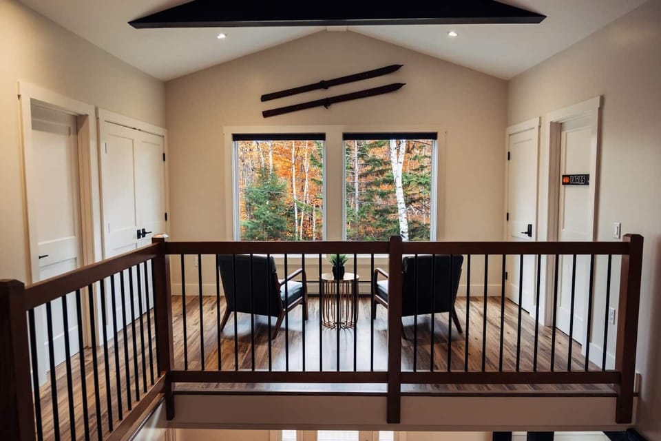 Upstairs sitting area with attached laundry closet.-