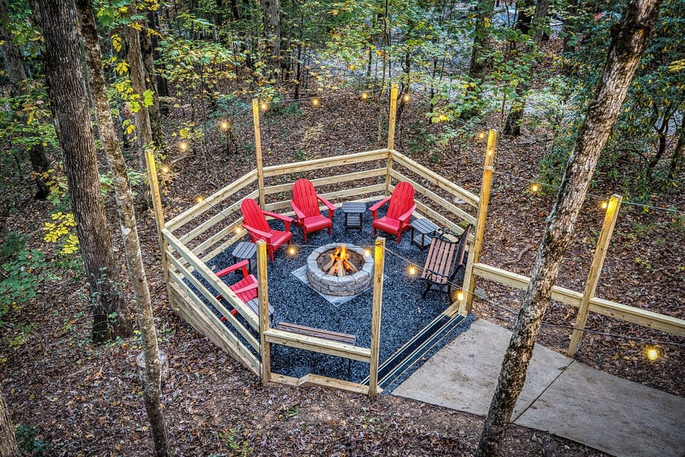 Gather your whole group around the fire pit — string lights on, Adirondack chairs pulled close, and someone already talking about s'mores.