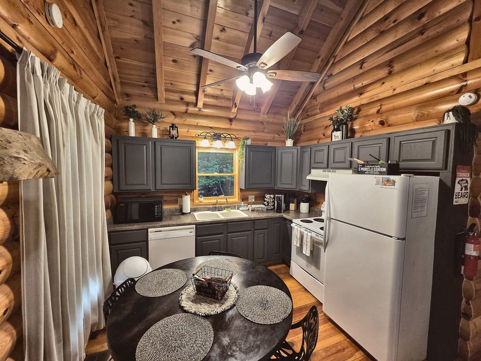 Cook for the whole crew without losing the conversation — the cabinets just got a fresh coat of paint, so you're stepping into the newest room in the house.