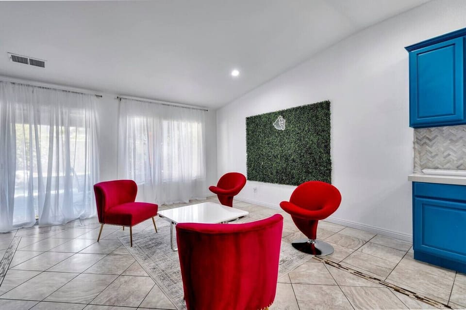 Seating area with 4 unique chairs and backdrop for IG photos!