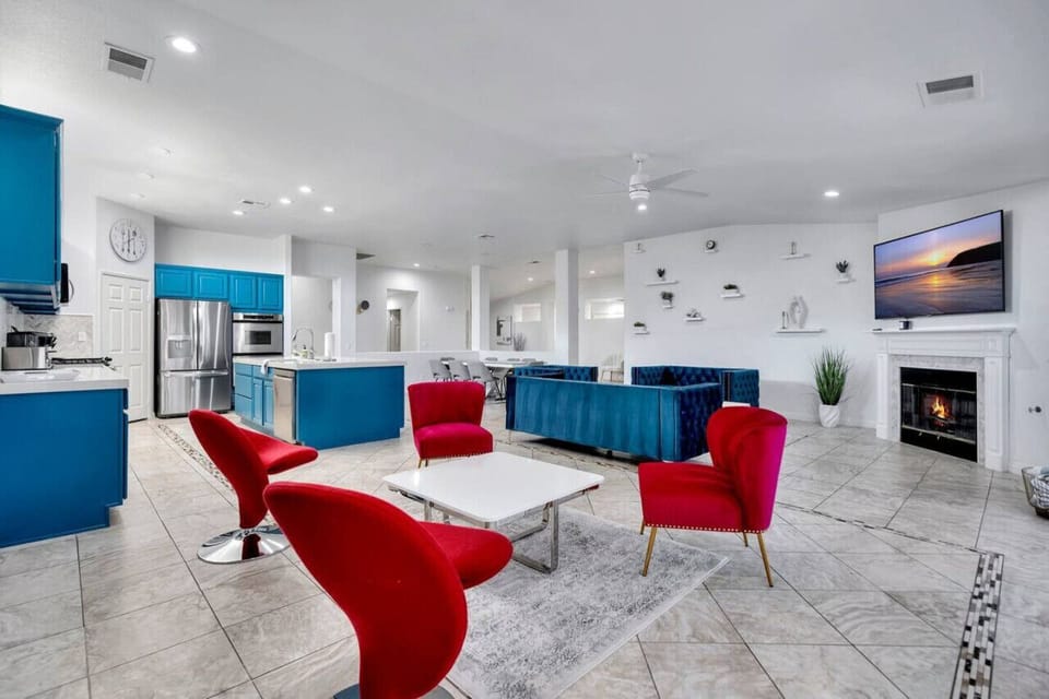 Seating area with 4 unique chairs and backdrop for IG photos!