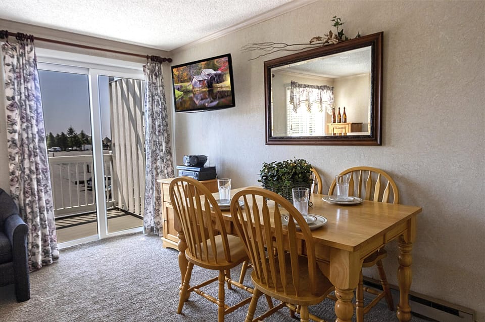 Gather around the dining table, with seating for four, to share a meal!