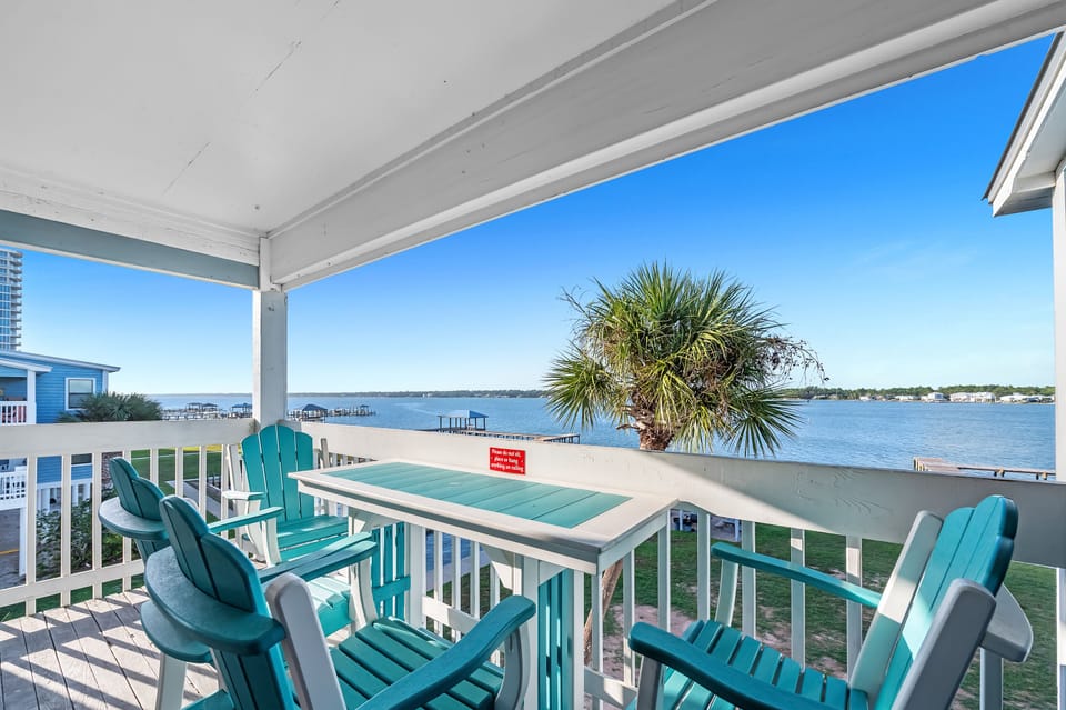 Relax on the balcony with lagoon views as boats drift by and breezes sway