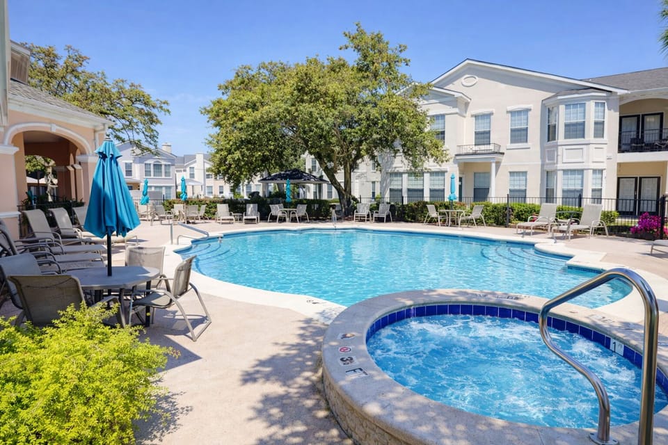 Trade screens for sunshine and pool time. Clubhouse front pool and hot tub