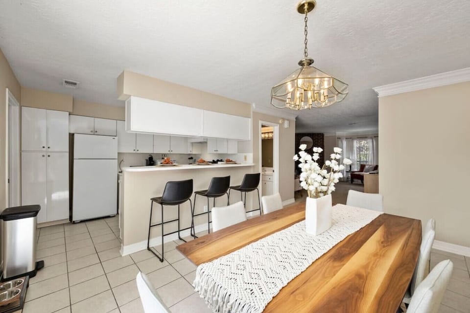 Dining area with seating for 6 plus kitchen island bar stools — perfect for group meals