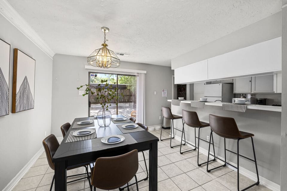 Dining area for 6 with breakfast bar seating — perfect for shared meals and group gatherings