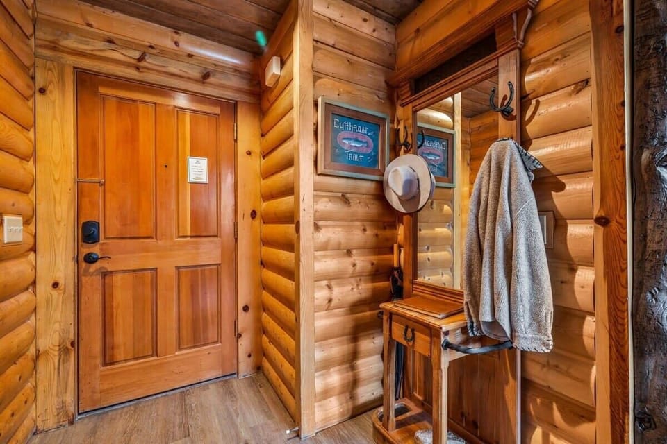 The view of the home's front door is where you will find a front hallway with space to store your outdoor gear before settling into the home.