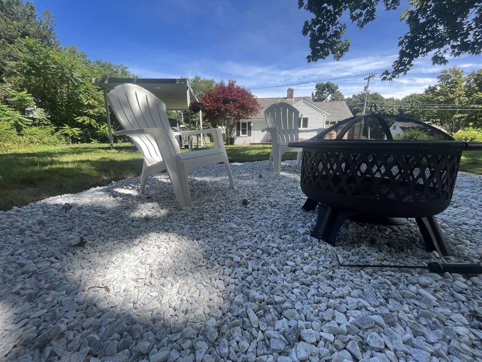 Fire pit in back for a great night after a day at the beach