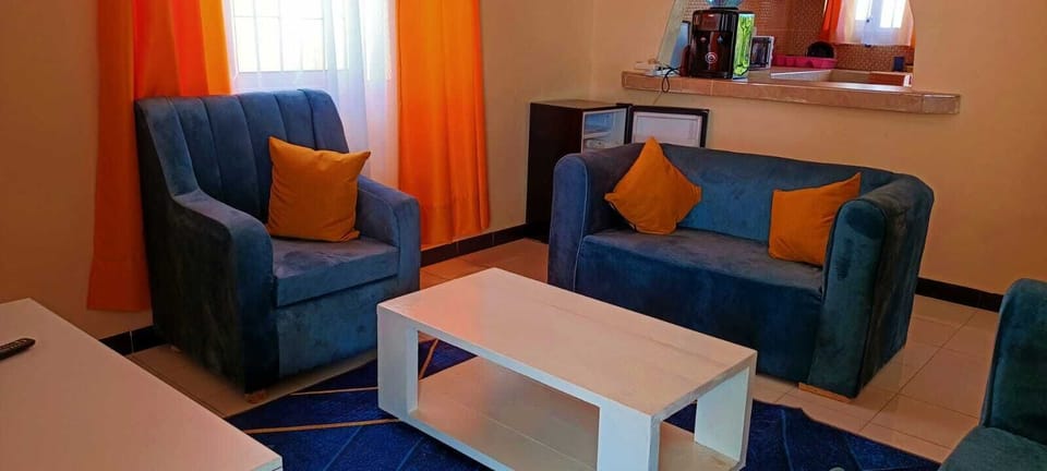 Business Apartment | Living area | 24-inch Smart TV with digital channels