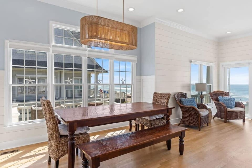 The dining table features benches for a close-knit dining experience.