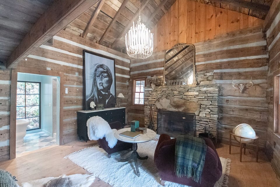 Front cabin bedroom, sitting area and large fireplace